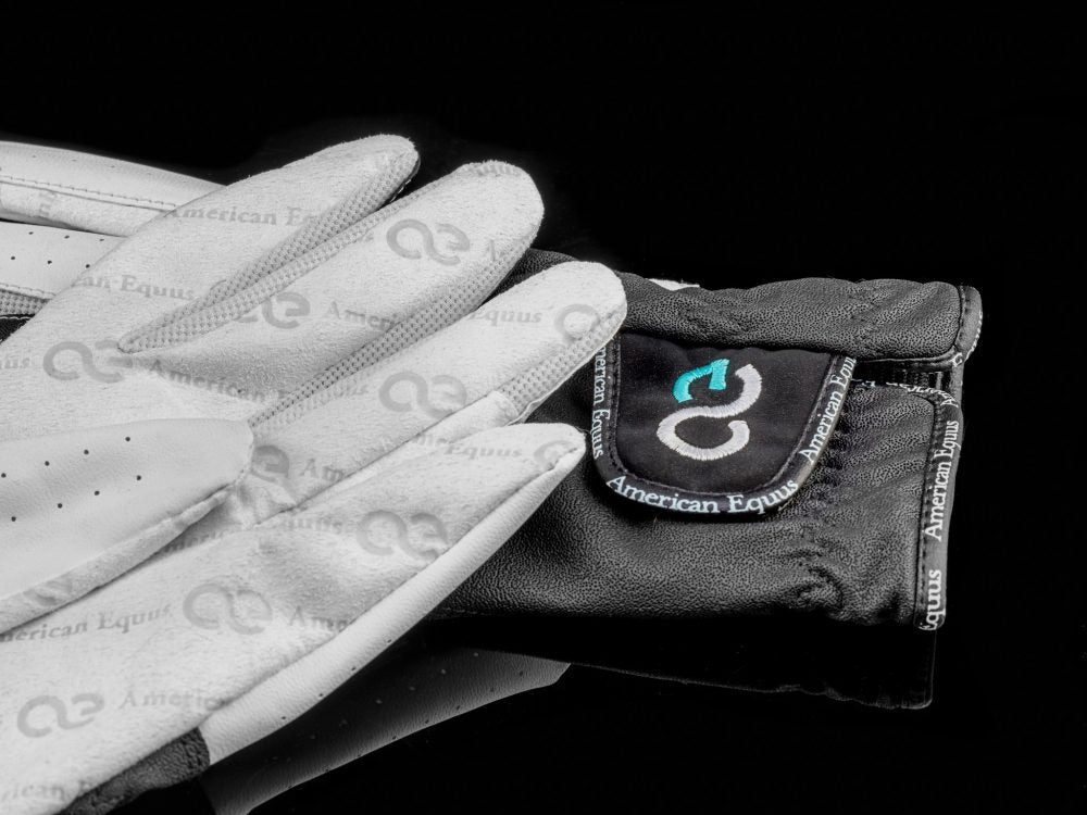 black and white riding gloves