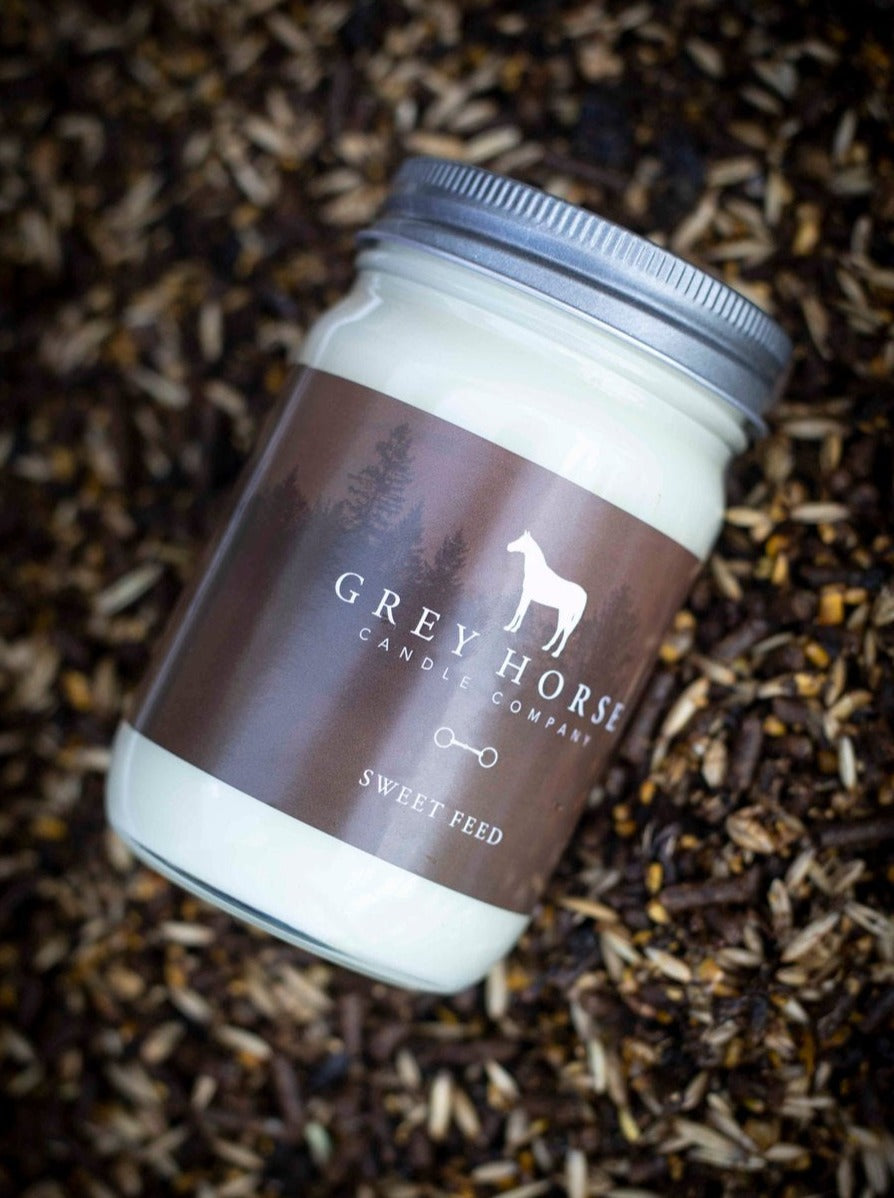 Jar of candle with 'Grey Horse Candle Company' branding on a textured background