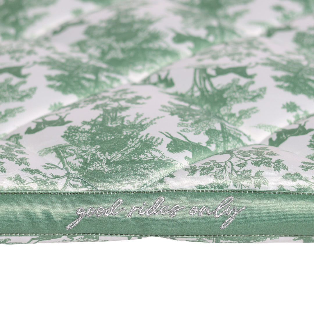 Green and white patterned fabric with 'good vibes only' text on a green ribbon.