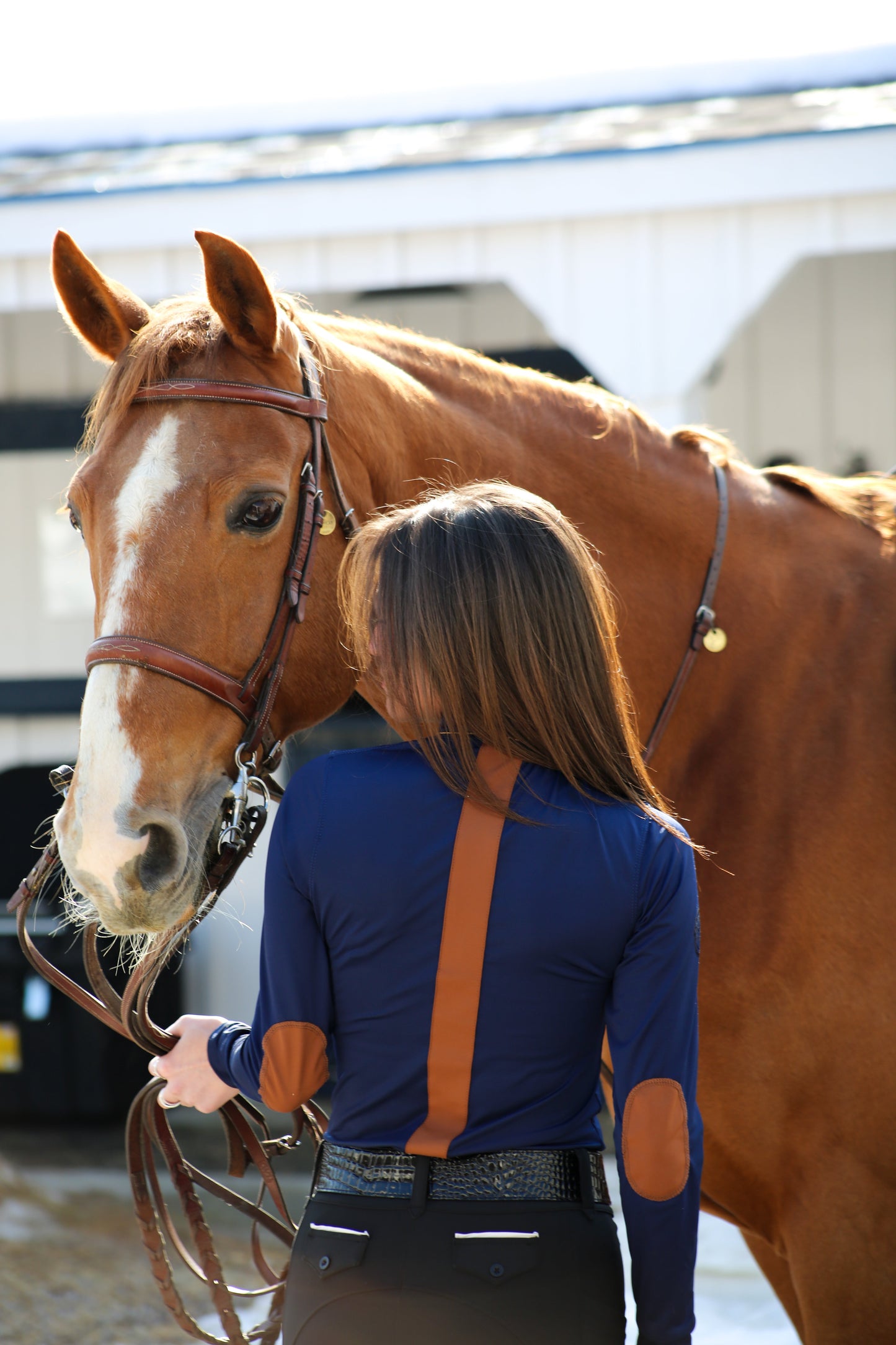 blue long sleeve riding top with sueded trim