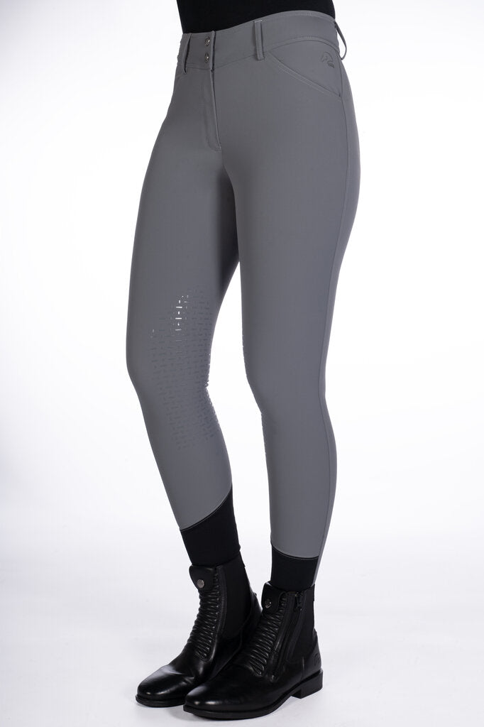 Gray riding pants with black boots on a white background
