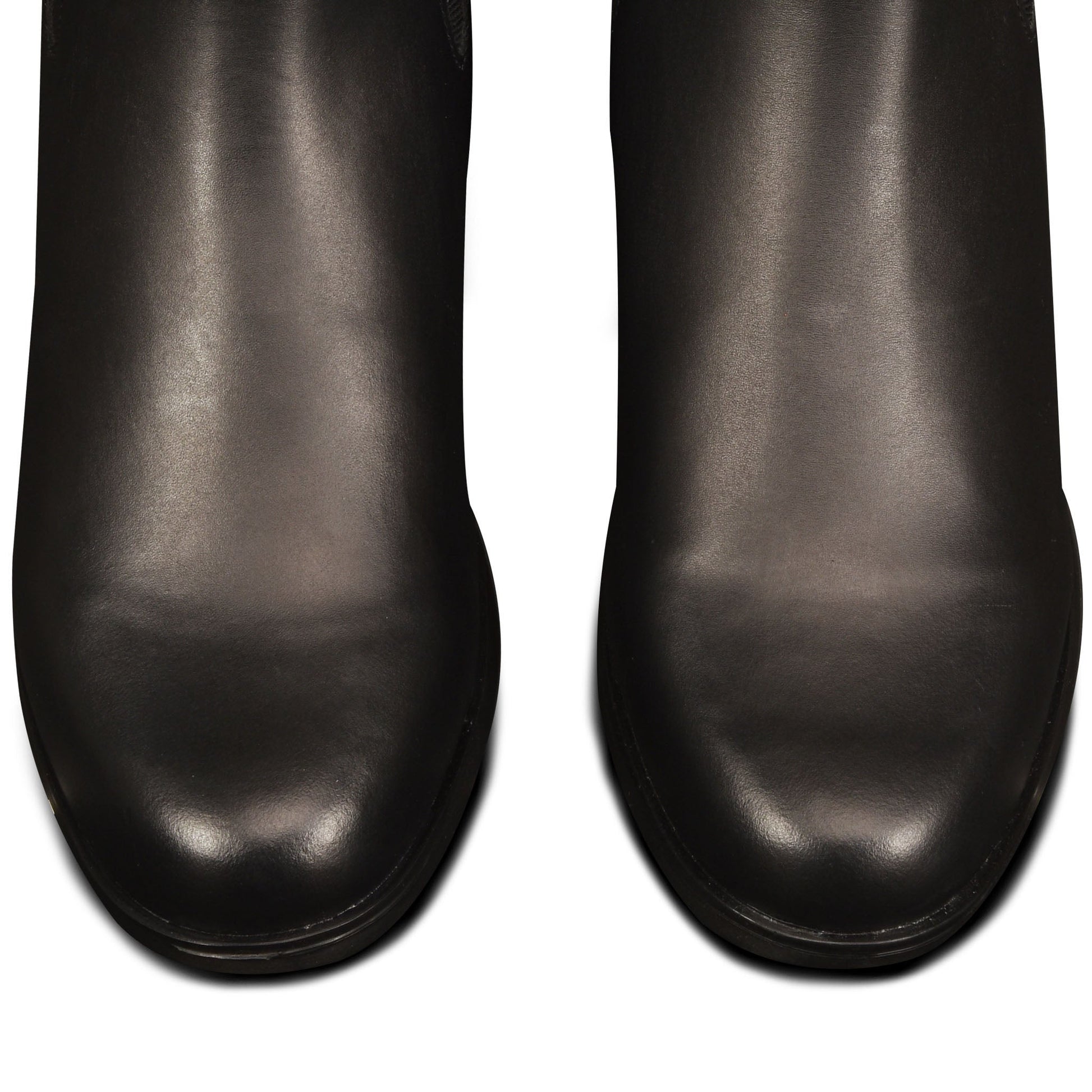 Pair of black leather shoes on a white background