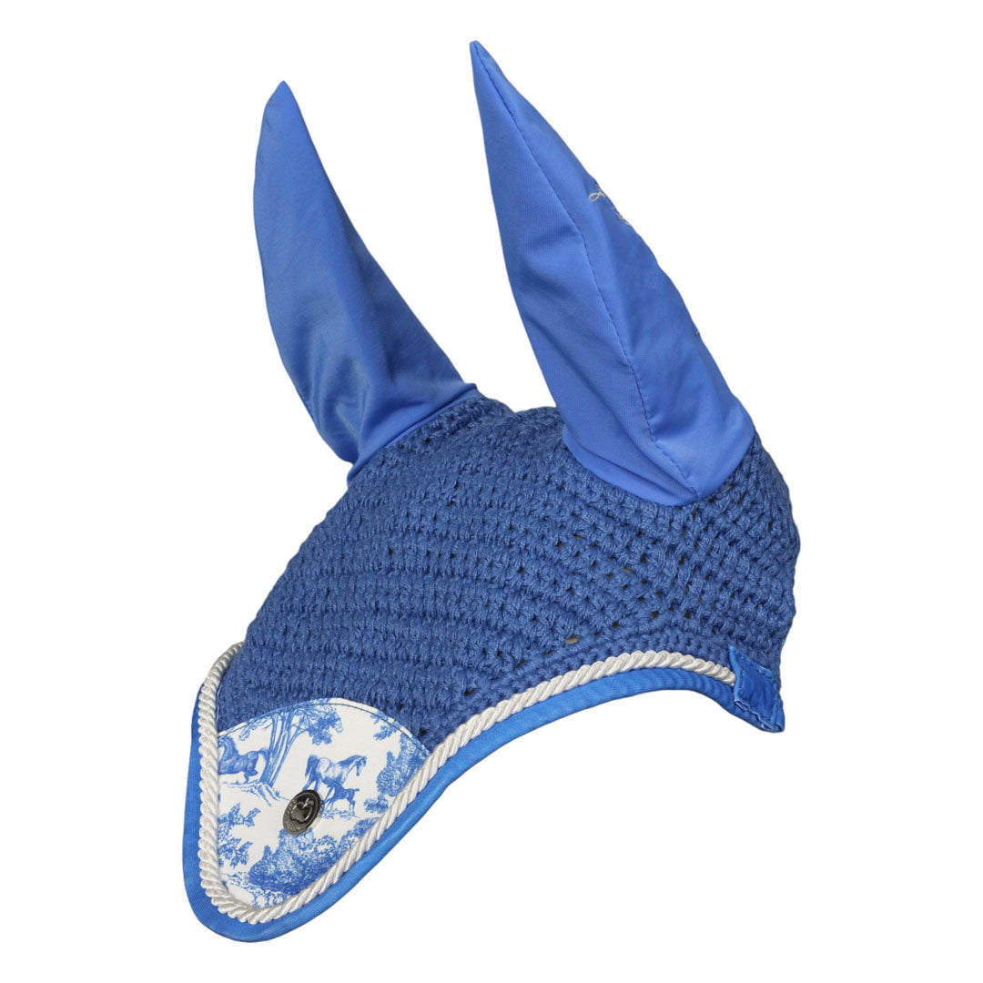 Blue ear bonnet with decorative patch on a white background