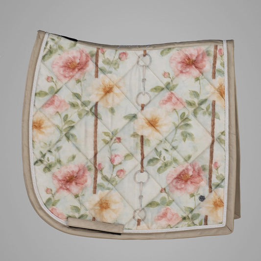 Floral patterned saddle pad on a gray background