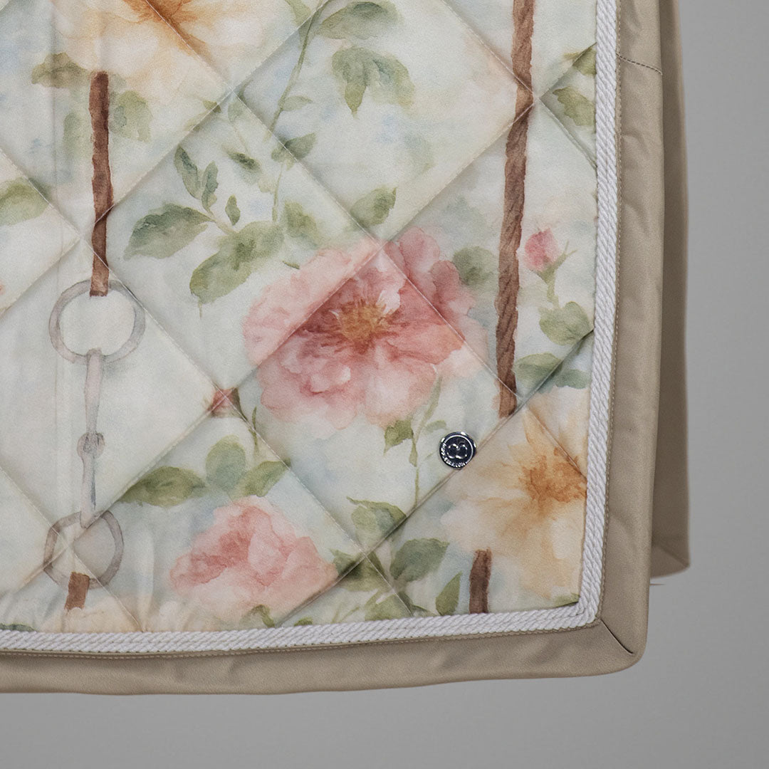 Floral quilt with geometric pattern on a plain background
