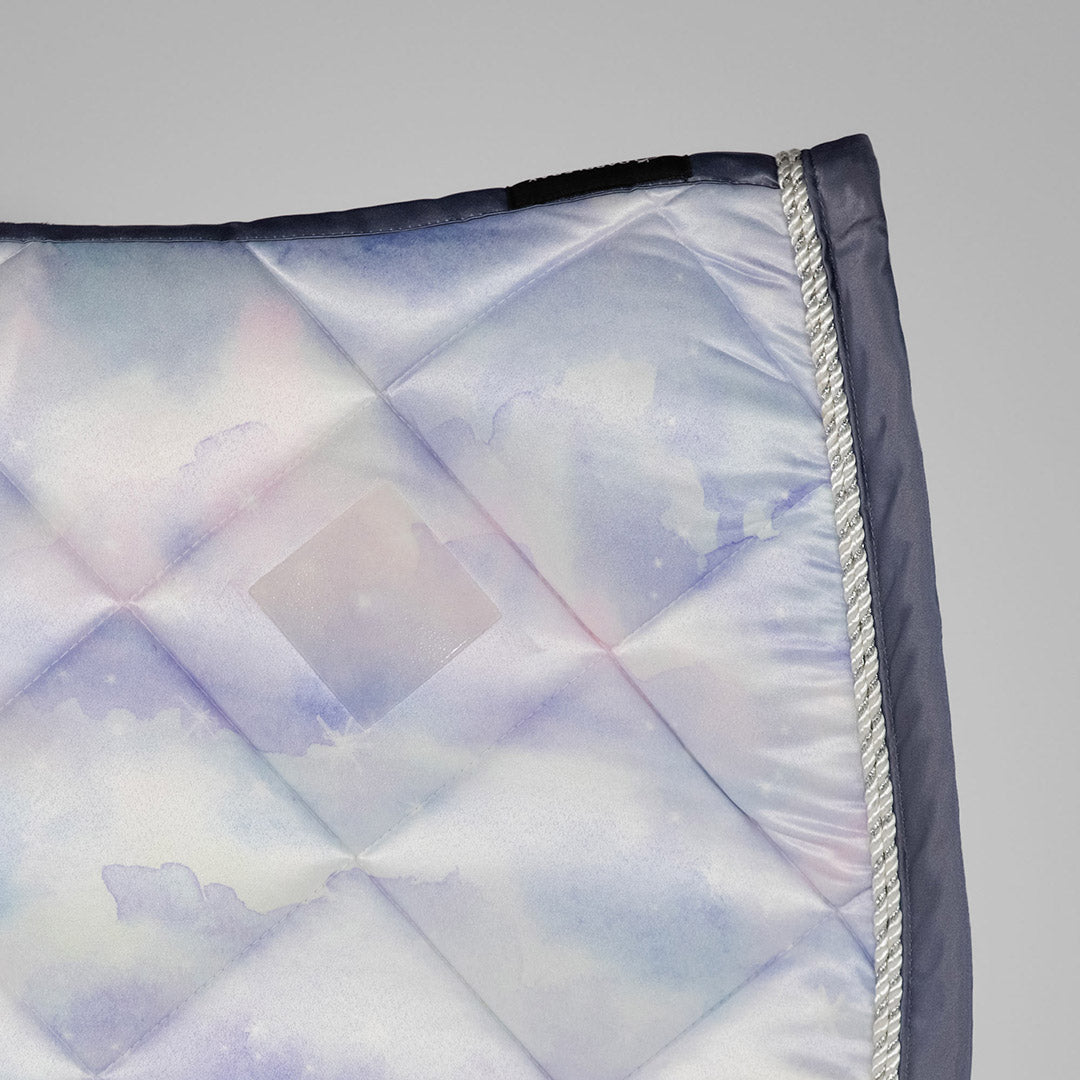 Quilted fabric with a diamond pattern on a gray background