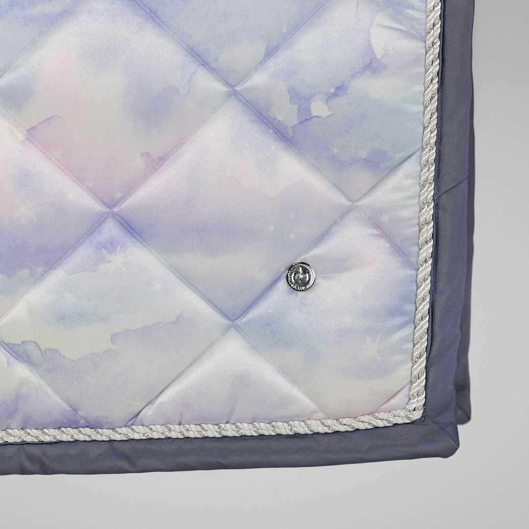 Quilted fabric with a subtle pattern on a light gray background