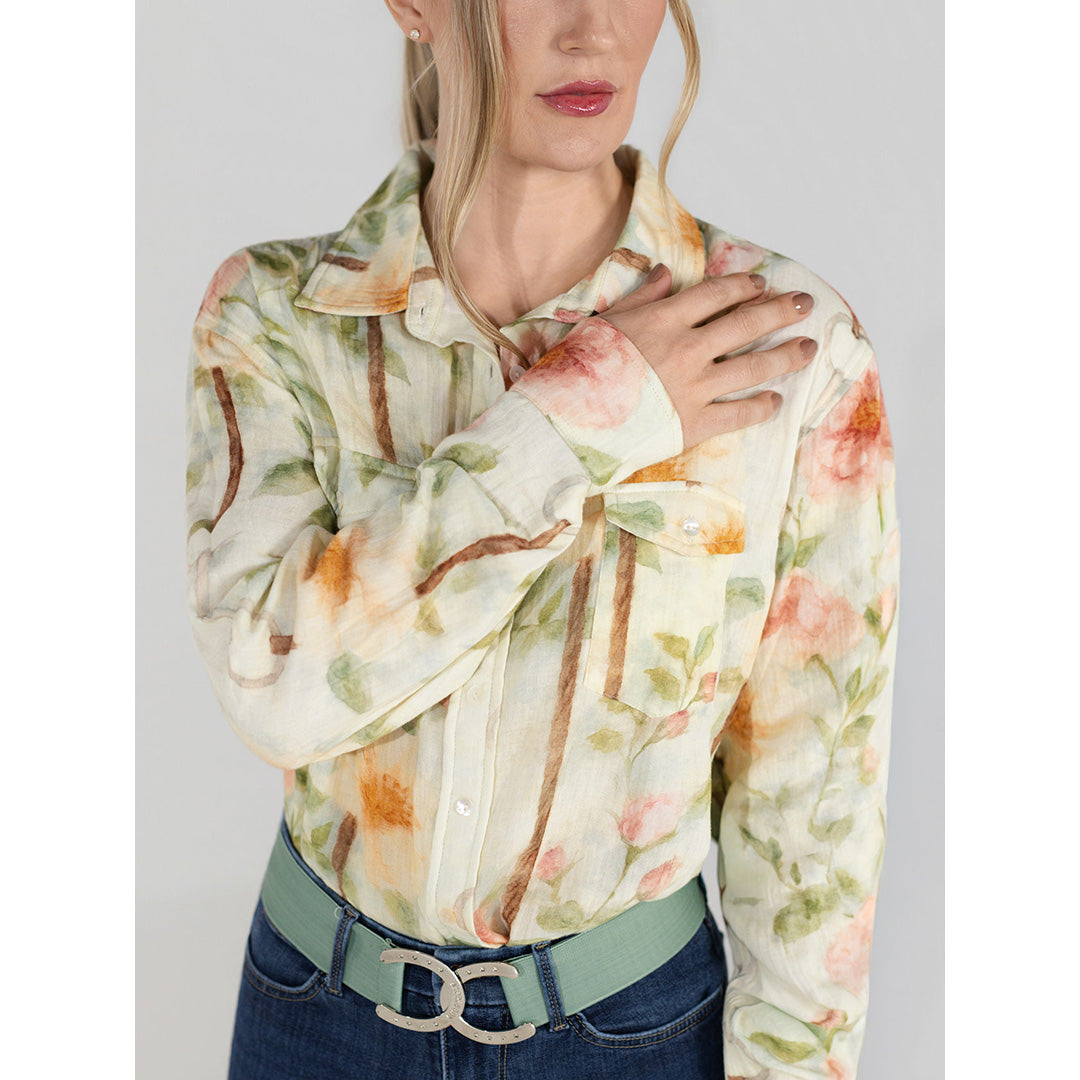Woman wearing a floral blouse with a plain background