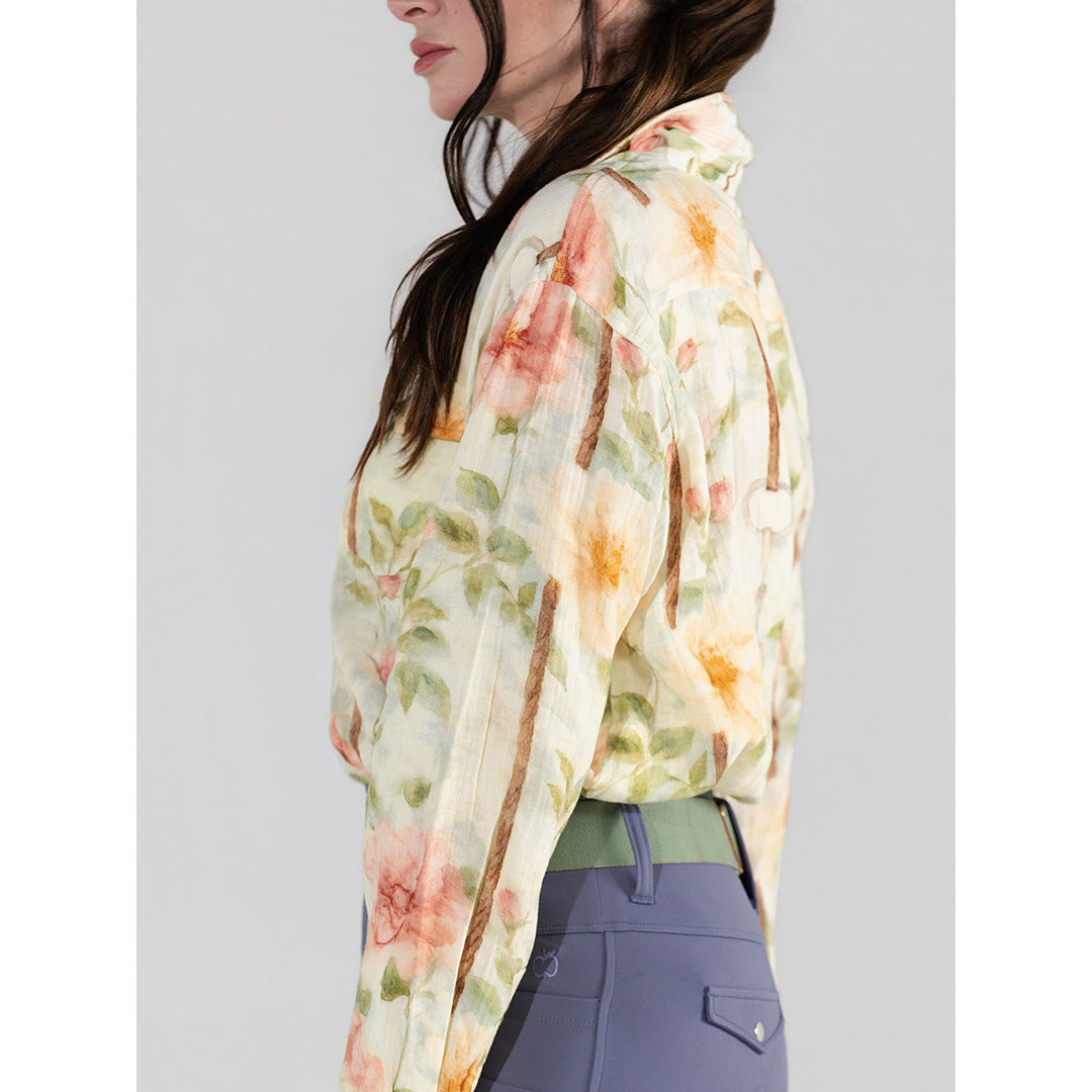 Woman wearing a floral blouse with a plain background