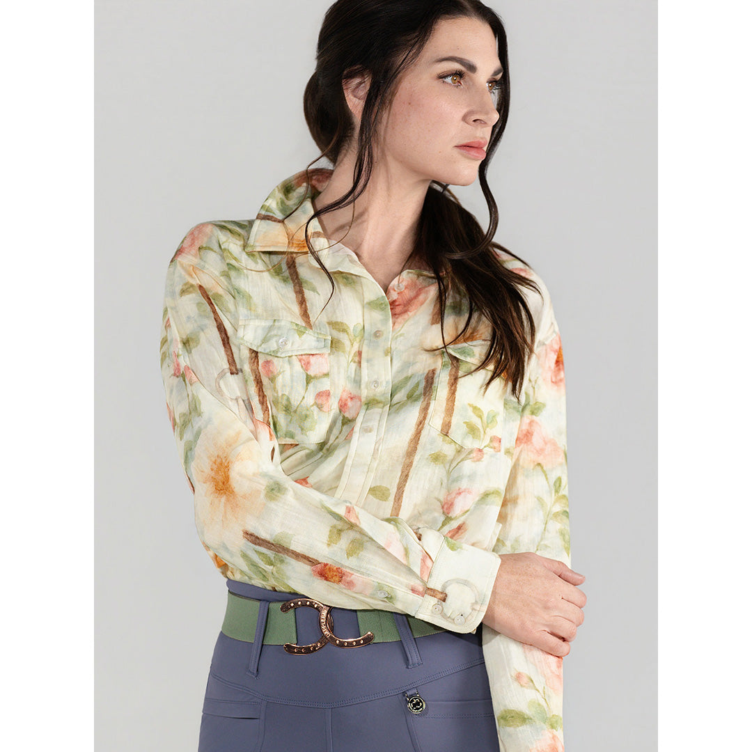 Woman wearing a floral blouse with a plain background