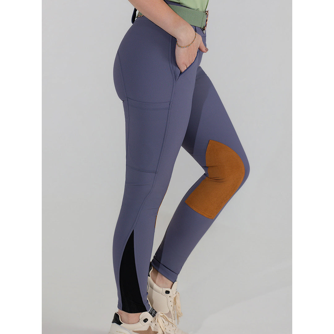 purple riding pants with a brown patch