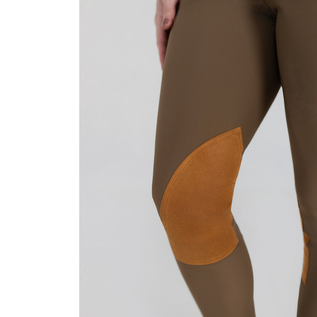 Brown equestrian pants with orange patches 