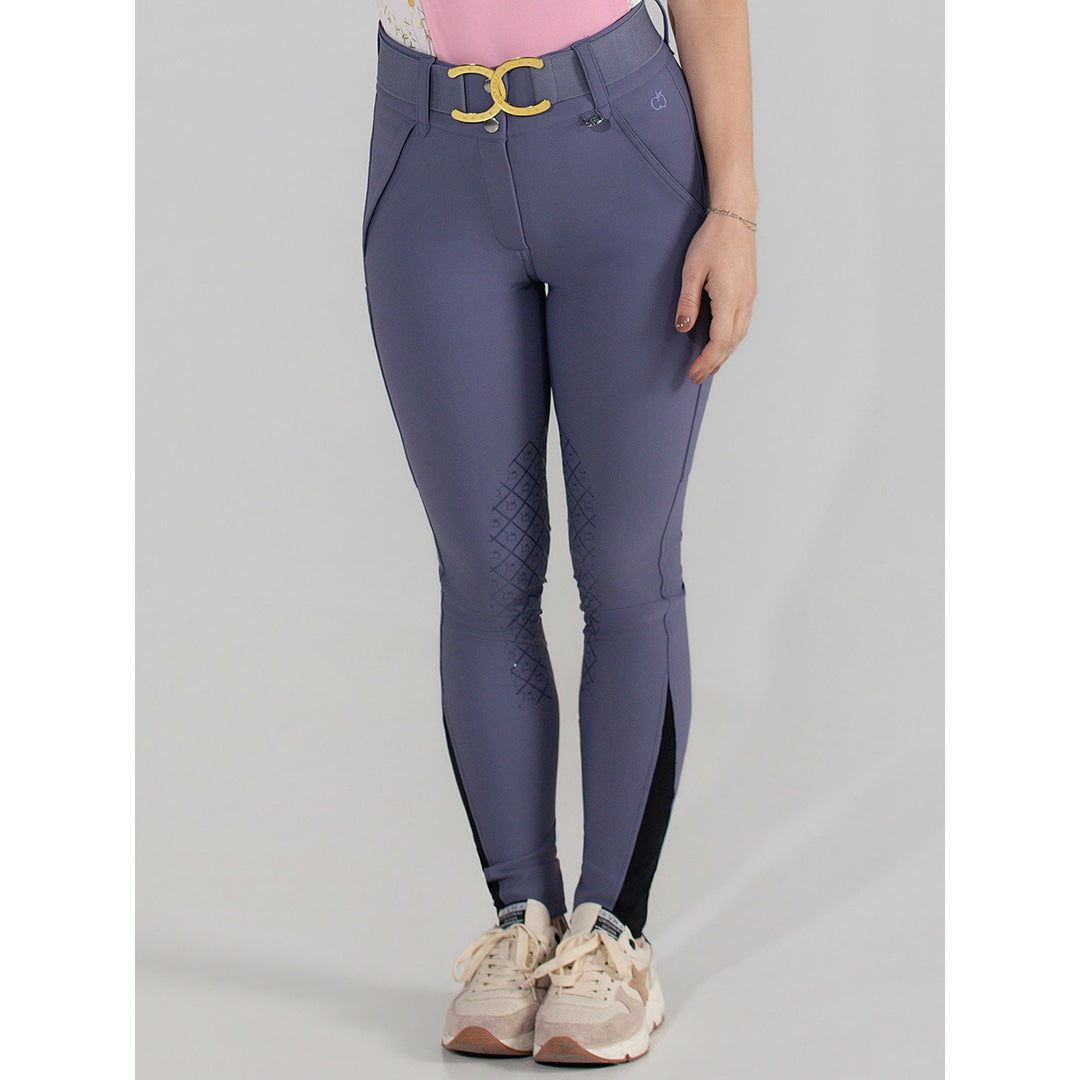 Purple riding pants with a yellow buckle on a gray background