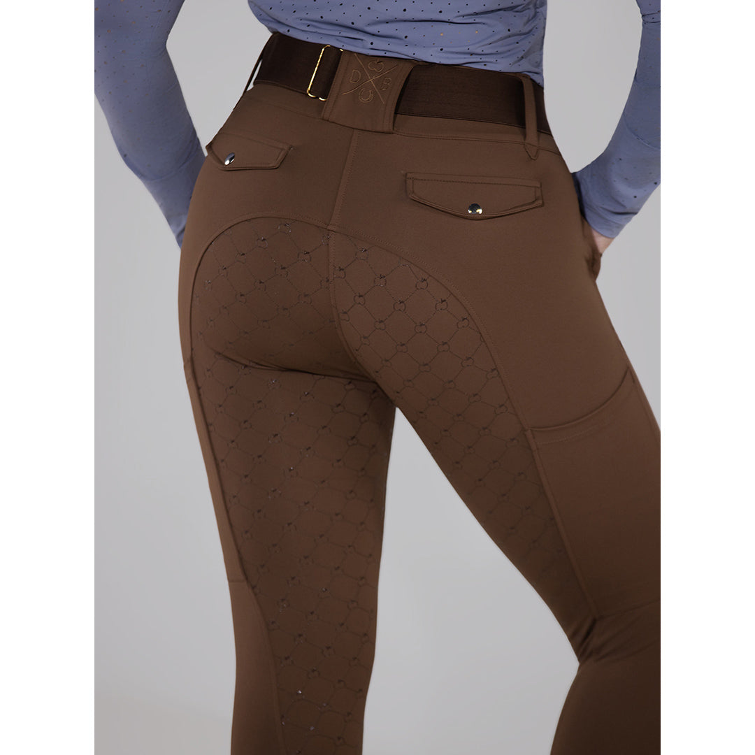 Brown riding pants with a patterned design on a plain background