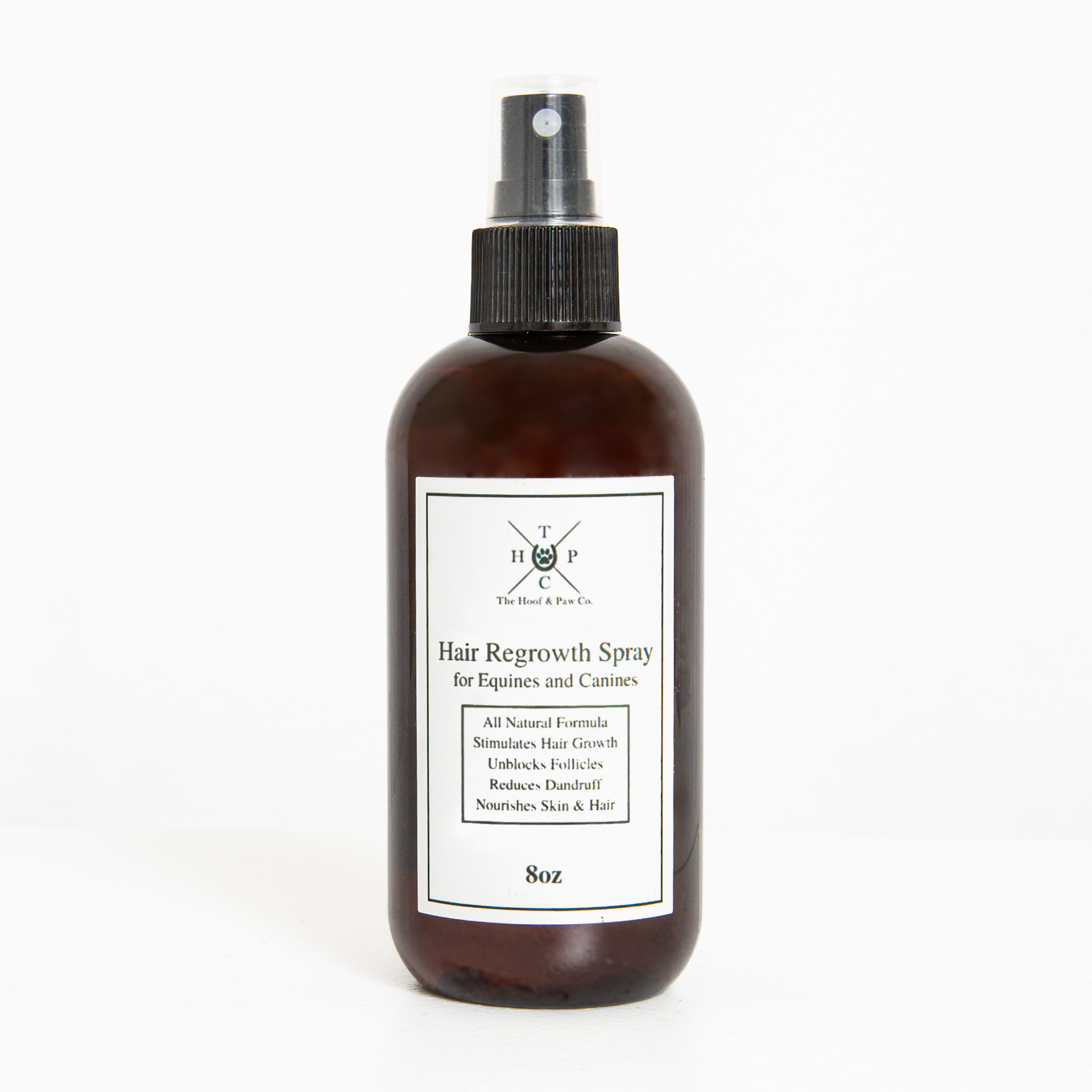 Hair regrowth spray bottle with label on a white background