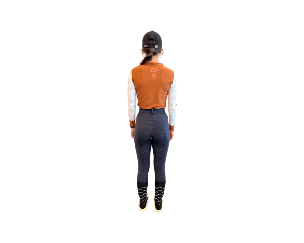 Rust colored long sleeve riding shirt with printed sleeves