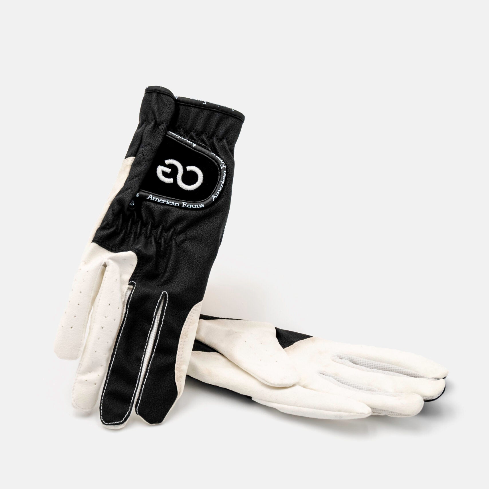black and white riding gloves
