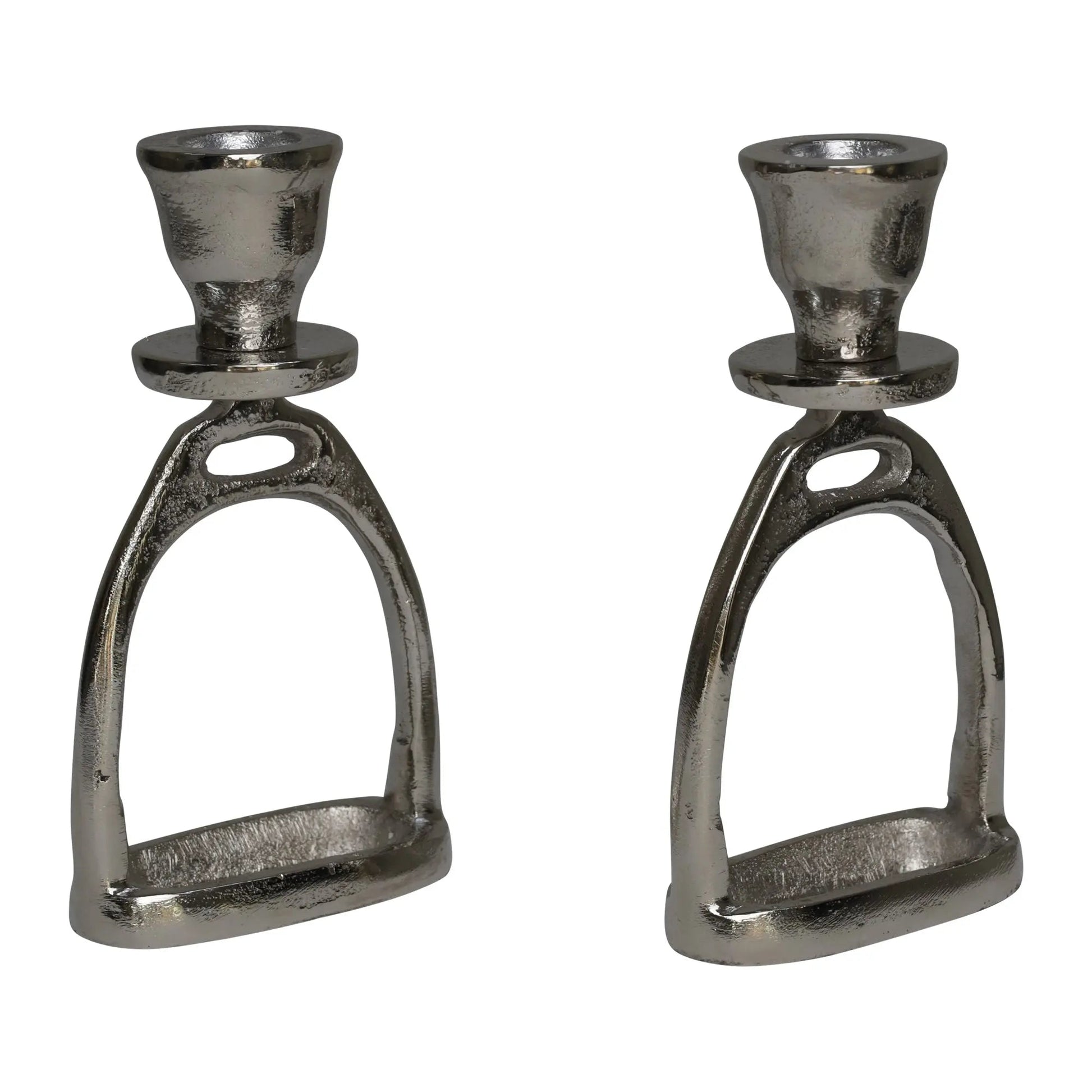 Two metallic candle holders shaped like horse stirrups on a white background