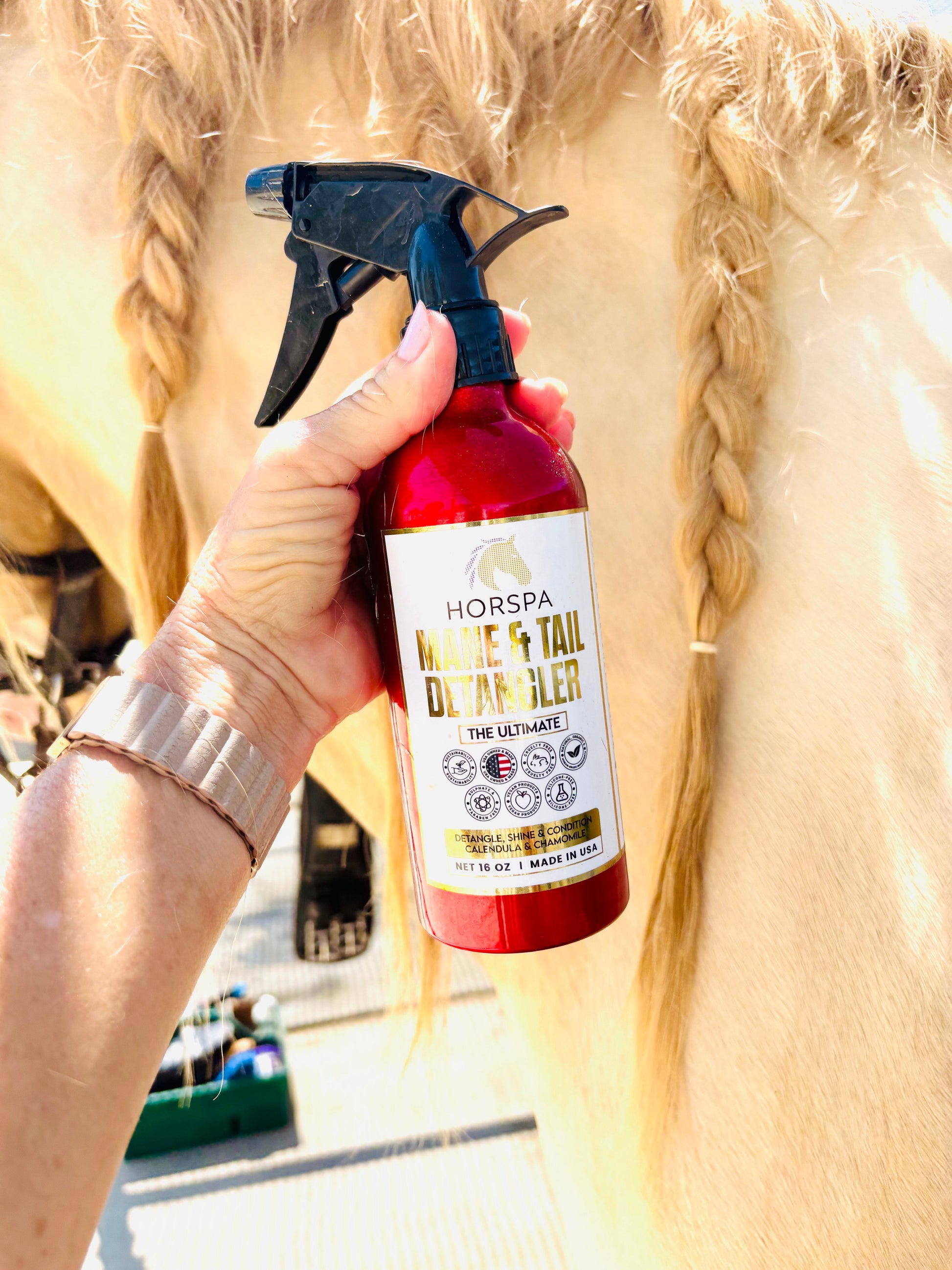  red and black bottle labeled 'Horspa Muscle & Tail Detangler' 