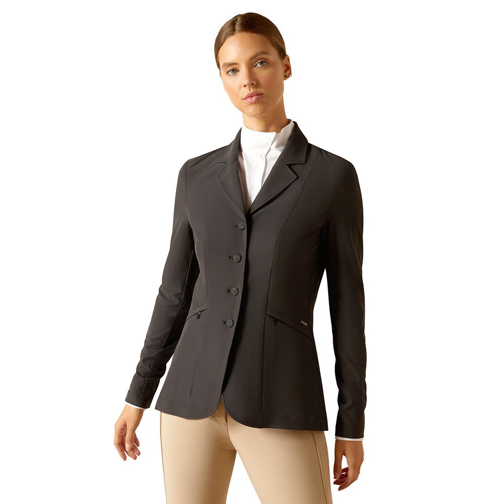 Woman wearing a black equestrian jacket on a white background