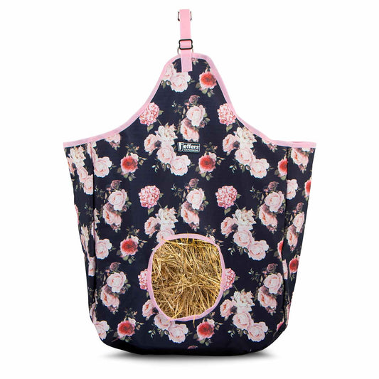 Floral-patterned hay bag with a pink strap on a white background