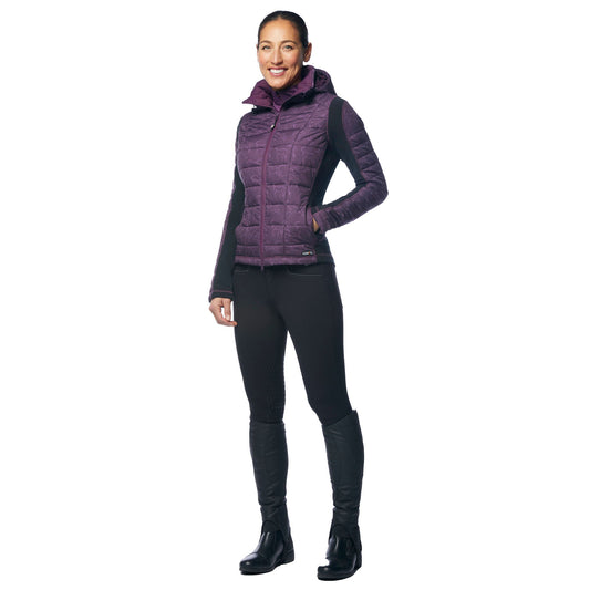Woman wearing a purple puffer vest, black leggings, and black boots on a white background